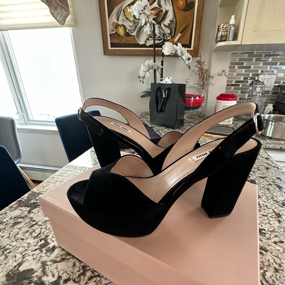 Black platform Miu miu sandals.